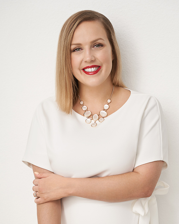 Real estate headshots in San Antonio of female on white background with soft lighting