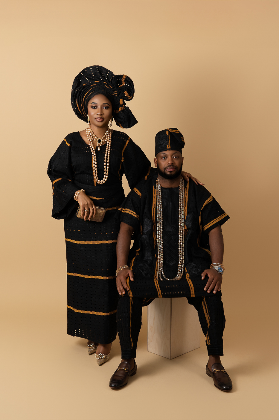 Elegant studio engagement portraits in San Antonio, couple dressed in formal attire.